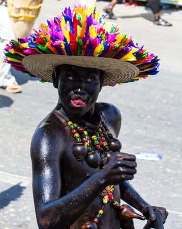 Barranquilla, Colombia - March 1, 2014 - Performers in elaborate costume sing, dance, and stroll their way down the streets of Barranquilla during the Battalla de Flores during Carnivalのeditorial素材