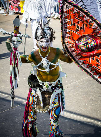 Barranquilla, Colombia - March 1, 2014 - Performers in elaborate costume sing, dance, and stroll their way down the streets of Barranquilla during the Battalla de Flores the pinnacle of the Carnival de Barranquilla parades.のeditorial素材
