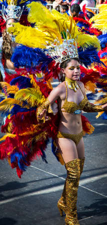 Barranquilla, Colombia - March 1, 2014 - Performers in elaborate costume sing, dance, and stroll...