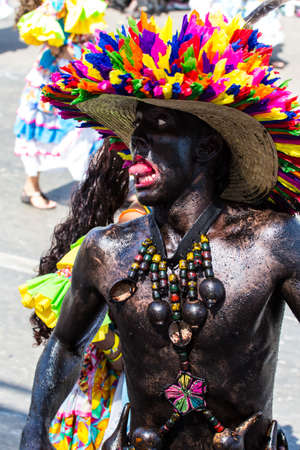 Barranquilla, Colombia - March 1, 2014 - Performers in elaborate costume sing, dance, and stroll their way down the streets of Barranquilla during the Battalla de Flores during Carnivalのeditorial素材