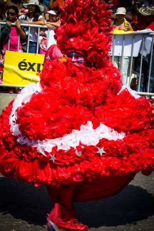 Barranquilla, Colombia - March 1, 2014 - Performers in elaborate costume sing, dance, and stroll their way down the streets of Barranquilla during the Battalla de Flores during Carnivalのeditorial素材