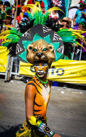 Barranquilla, Colombia - March 1, 2014 - Performers in elaborate costume sing, dance, and stroll their way down the streets of Barranquilla during the Battalla de Flores. The Pinnacle of the Carnival de Barranquilla parades.のeditorial素材