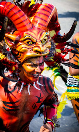 Barranquilla, Colombia - March 1, 2014 - Performers in elaborate costume sing, dance, and stroll their way down the streets of Barranquilla during the Battalla de Flores. The Pinnacle of the Carnival de Barranquilla parades.のeditorial素材