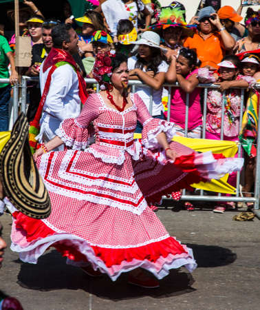 Barranquilla, Colombia - March 1, 2014 - Performers in elaborate costume sing, dance, and stroll their way down the streets of Barranquilla during the Battalla de Flores the pinnacle of the Carnival de Barranquilla parades.のeditorial素材