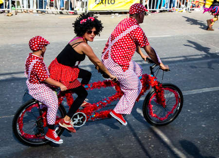 Barranquilla, Colombia - March 1, 2014 - Performers in elaborate costume sing, dance, and stroll their way down the streets of Barranquilla during the Battalla de Flores. The Pinnacle of the Carnival de Barranquilla parades.のeditorial素材