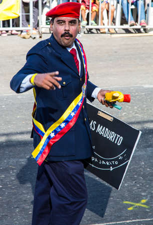 Barranquilla, Colombia - March 1, 2014 - Performers in elaborate costume sing, dance, and stroll their way down the streets of Barranquilla during the Battalla de Flores. The Pinnacle of the Carnival de Barranquilla parades.のeditorial素材