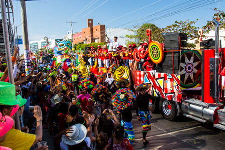 Barranquilla, Colombia - March 1, 2014 - Colorful floats full of singers, dancers, and models make their way down the street during the Battalla de Flores. The pinnacle parade of the Carnival de Barranquilla.のeditorial素材
