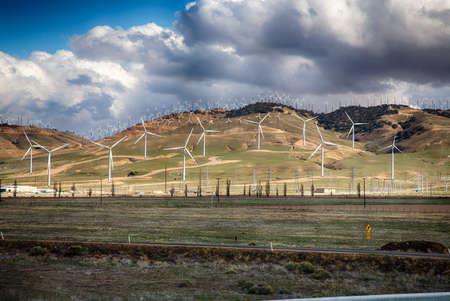 Wind Turbines line the hillsides outside Bakersfield, California.のeditorial素材