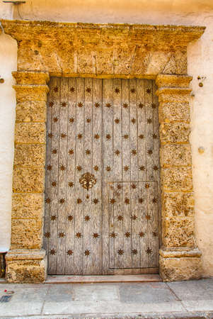 The ornate and historic doors of Cartagena's colorful old city streets.の写真素材