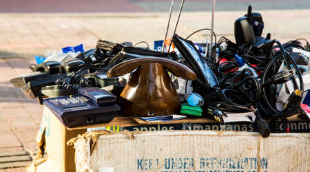 Old telephones and other junk on the table of a street vendor in Cartagena's Getsemani neighborhood.