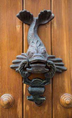 Ornate door knockers and detail on th famous doors of Cartagena's historic old city.の写真素材
