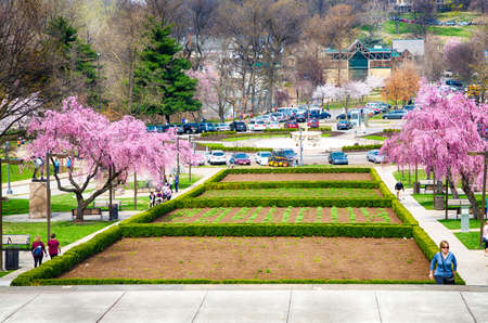 April 13th, 2014: Touristswalk up the steps to the Philadelphia Art Museum for a view of the gardens and schuykill River beyond.のeditorial素材
