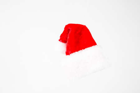 A red and white santa claus hat on white backgroundの写真素材