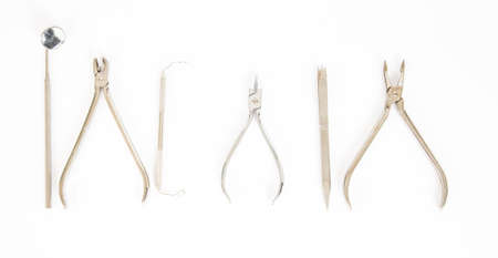 A set of tool used by orthodontisits on a white background.の写真素材