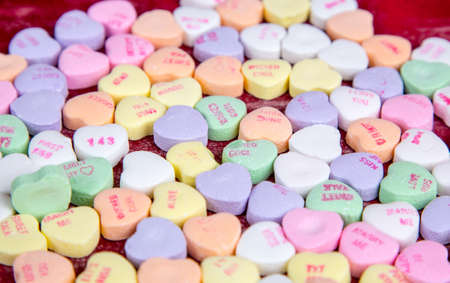 Valentine's candy conversation hearts with simple words of love on them.の写真素材