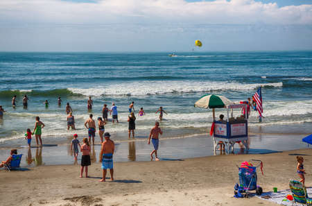 Ocean City, NJ - July, 6, 2016 -vacationers enjoy the sun and sand on Ocean City's boardwalk and beach.のeditorial素材