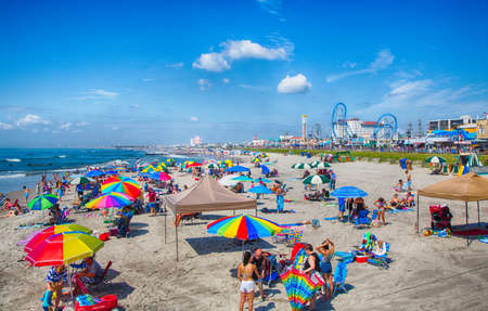 Ocean City, NJ - July, 6, 2016 -vacationers enjoy the sun and sand on Ocean City's boardwalk and beach.のeditorial素材
