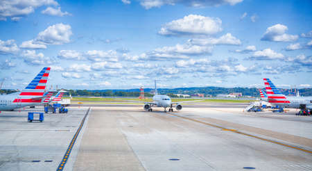 September 10, 2017, Washington, DC, USA: American airlines planes pull up the gates on a sunny day at Reagan National Airport in Washington.のeditorial素材