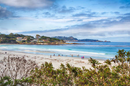 Beachgoers enjoy the sun on Carmel's white sand beach.の写真素材