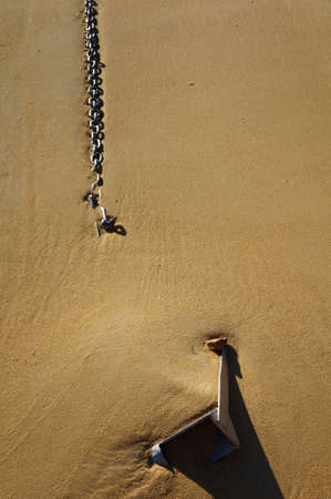 Anchor and chain on the beach at Anchorage Bay, New Zealandの写真素材
