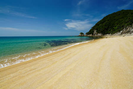 Anatakapau bay and blue sky in Abel Tasman National Park, New Zealand.の写真素材