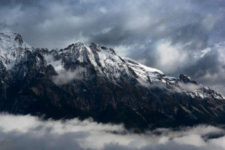 View of the snowcapped Alps with clouds の写真素材