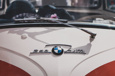Ludwigsburg, Germany - April 8, 2018: Emblem and front of a BMW Isetta 250 oldtimer car at the 2018...