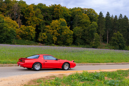 Heidenheim, Germany - October 3, 2021: Pontiac Firebird american oldtimer vintage muscle car on a country road near Heidenheim an der Brenz, Germany.のeditorial素材
