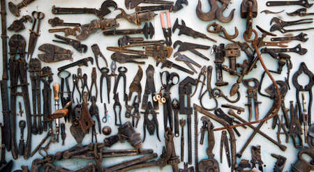 hanging old tools on garage doorsの写真素材
