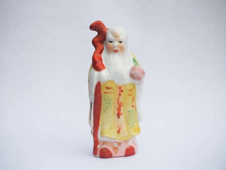 Chinese ceramic doll on the white backgroundの写真素材