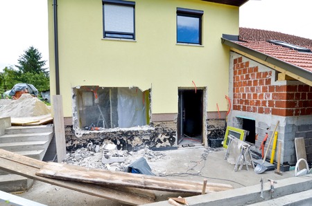 Rebuilding a family house and adding an 
extension, opening walls and making a new terrace. Construction toolyの写真素材
