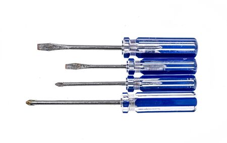 Set of old, used screwdrivers isolated in studio. Color photo od blue screwdriver set.の写真素材