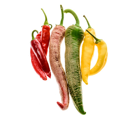 Different variety of hot peppers or chilies, isolated on white. Hot pepper Macedonian Fringed, Sarit...