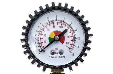 Industrial manometer pressure gauge isolated on a white background. Air compressor gun manometer with black needle and color scale for psi or bar.の写真素材