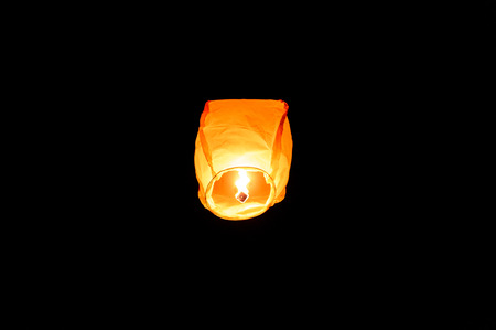 Orange paper sky flaming lantern, flying lantern, floating lantern, hot-air balloon is flying with a...