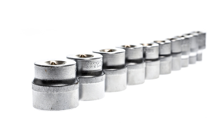 Set of Metallic Socket wrench tools isolated on white background. Metric set of work tools and...