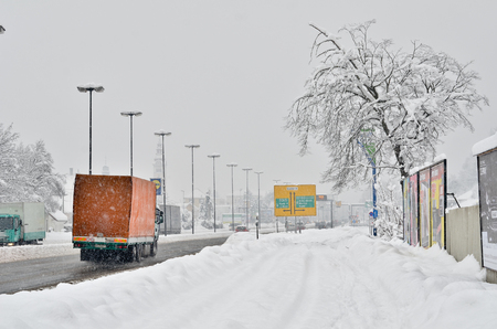 Ljubljana, Slovenia - January 17, 2013: Streets of Ljubljana a recovered in snow. Traffic in heavy snow.のeditorial素材