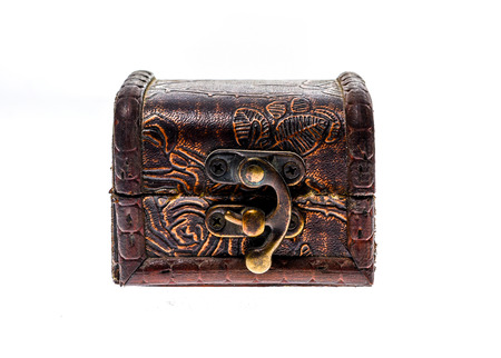 Old wood chest jewelry box closed isolated on white background. Small miniature vintage treasure...