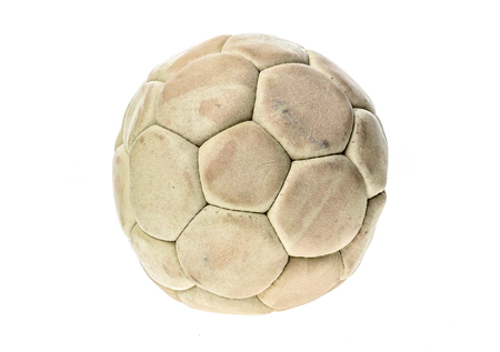 Old, used and washed handball ball isolated on white. Old, used and obsolete sports equipment.の写真素材