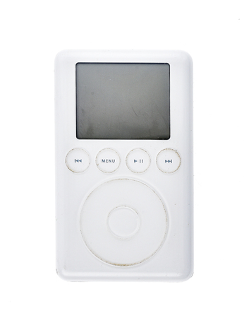 Old Apple iPod Classic 3rd Generation 15Gb 2003 mp3 player. Vintage used and worn white Apple iPod mp3 player isolated on white background.の写真素材