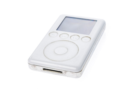 Old Apple iPod Classic 3rd Generation 15Gb 2003 mp3 player. Vintage used and worn white Apple iPod mp3 player isolated on white background.の写真素材
