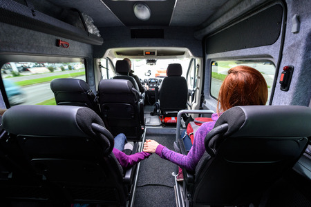 Family travelling in minivan to airport. People on public transport bus or van are travelling to airport for vacation. Aerodrome transfer service vehicle.の写真素材