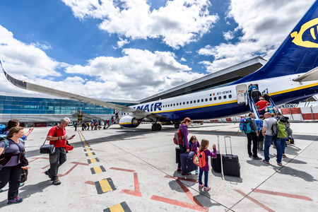 SANTIAGO DE COMPOSTELA, SPAIN - MAY 19, 2017: Passengers boarding Ryanair flight from Santiago Spain to Milano Italy on a sunny day. Ryanair is biggest budget low-cost airline in the world.のeditorial素材