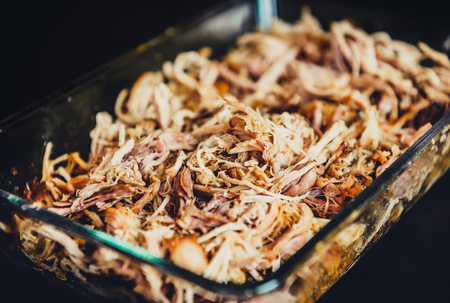 Pulled pork from oven in glass bowl ready for serving. Home made pulled pork made in house oven, smoker or barbecue bbq is ready to be eaten.の写真素材