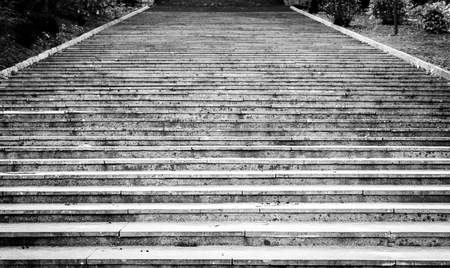 Old, majestic, grand, granite stone staircase leading up texture. Photo of giant stone steps leading to a ceremony venue.の写真素材