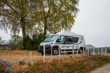 Campervan or motorhome parked in the countryside in nature. Camper van or motor home RV is parkedÂ under the trees when exploring the countryside nature of Slovenia, Europe.の写真素材