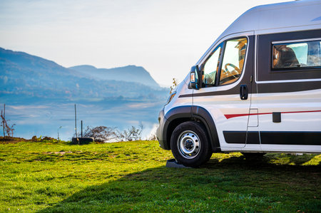 Campervan, Motorhome RV parked nextÂ to the lake or river in Bosnia and Herzegovina. Travelers...