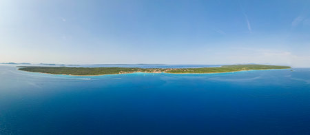 Aerial drone view of Croatian island Silba with beautiful beaches. Amazing Adriatic sea tourist vacation destination in Croatia. Panoramic paradise blue sea, sandy beaches, old houses and boatsの写真素材