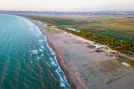 Aerial drone photo of Albanian coastline with sandy beaches, restaurants and resort camping for motorhomes or campervans.の写真素材