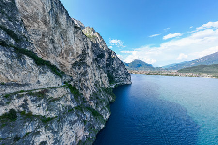 Famous bicycle road Sentiero del Ponale from Riva del Garda to Limone sul Garda. Famous biking roads near Riva del Garda on the northern part of Lake Garda.の写真素材